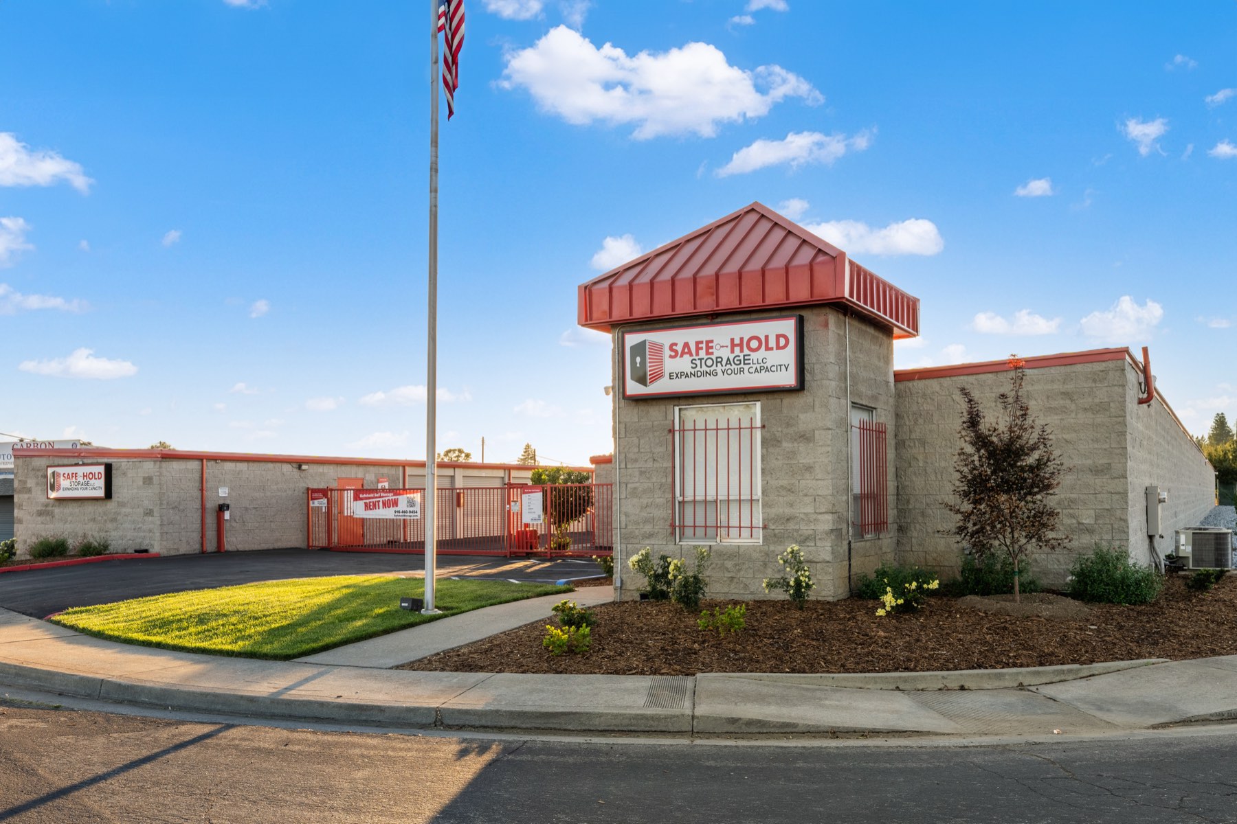 Landscaping, lawn and flag at Safe-Hold Storage